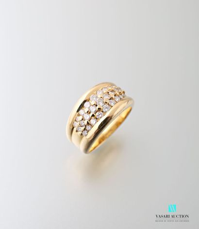 null 750-thousandths yellow gold ring paved with three lines of brilliants of diminishing...