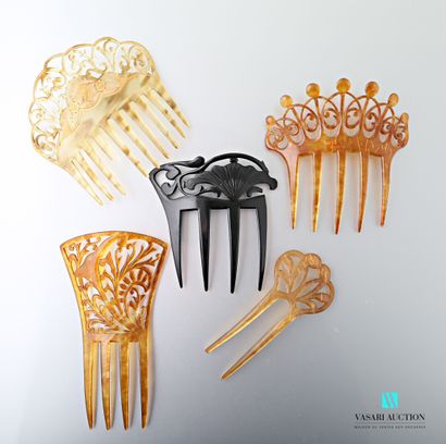 null Five combs in brown, black or yellow celluloid with cut-out decoration of volutes...