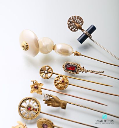 null Sixteen 19th and early 20th century gilded metal pins decorated with imitation...