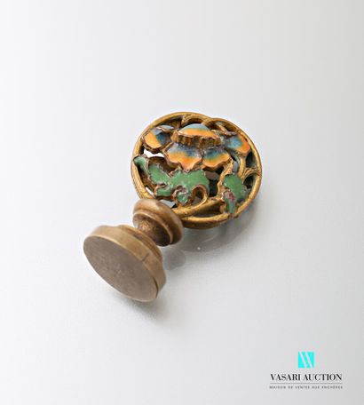 null Bronze stamp 1900 with enamelled decoration of an iris on one side and a poppy...