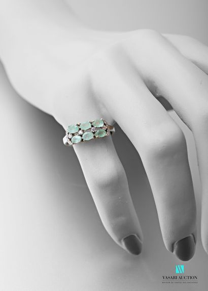null Half-ring in silver 925 thousandths set with two rows of oval emeralds and white...