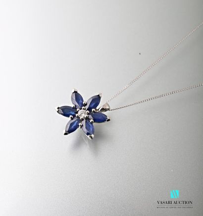 null A 750-thousandths gold chain and a flower-shaped pendant with a diamond in its...