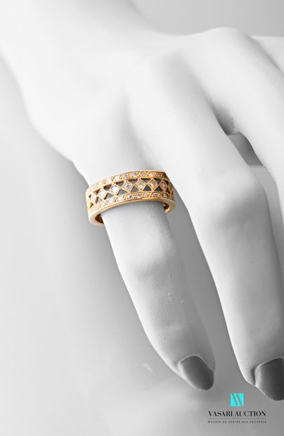 null Ring in 750 thousandths yellow gold pierced with diamond decoration paved with...