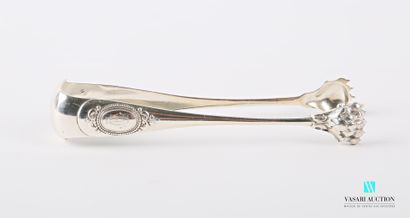 null Silver sugar tongs, the arms surmounted by medallions hemmed with pearls and...