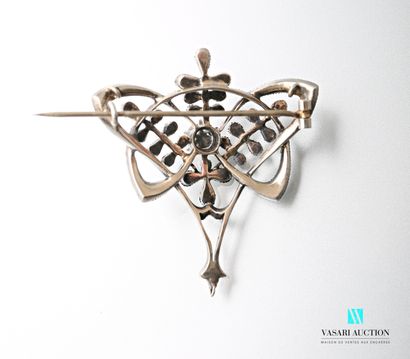null A silver brooch with interlaced openwork motifs embellished with stylized foliage...