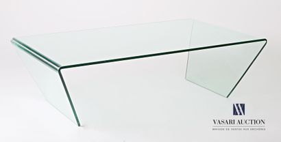 null Glass coffee table with a rectangular top finished with two trapezoidal uprights.

(some...