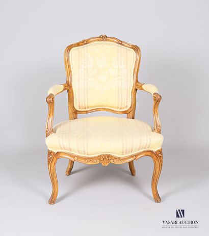 null Armchair in moulded and carved natural wood, the backrest with two flowers,...