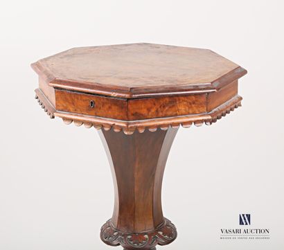 null Working table in natural wood, moulded and carved and veneered, the octagonal...