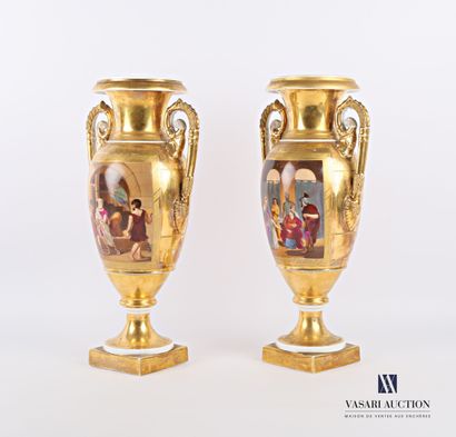 null A pair of white gilt porcelain vases of baluster shape, the body with polychrome...