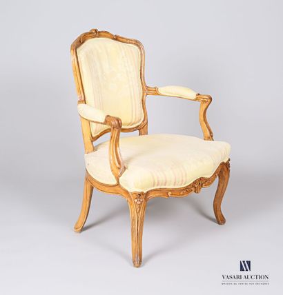 null Armchair in moulded and carved natural wood, the backrest with two flowers,...
