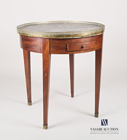 null A round mahogany veneered pedestal table, it opens in the waist with two drawers...