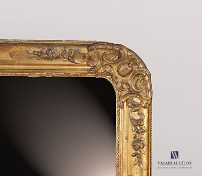 null Wood and stucco mirror, carved and gilded, decorated with blind medallions surrounded...