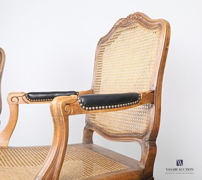 null Pair of armchairs in natural wood, moulded and carved, the backrest is fluted,...