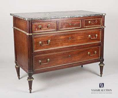 null A mahogany and mahogany veneer chest of drawers with inlaid leaves in brass...