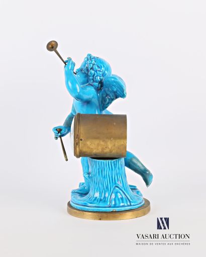 null Turquoise earthenware and bronze clock representing an angel with a trumpet,...