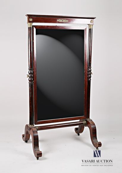 null A mahogany and mahogany veneer psyche mirror, standing on four inverted bracket...