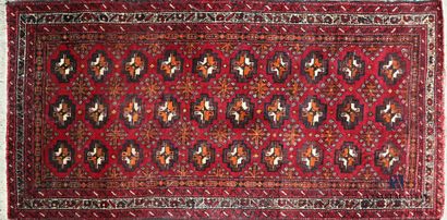 null Woolen carpet decorated with friezes alternating medallions and stylized floral...