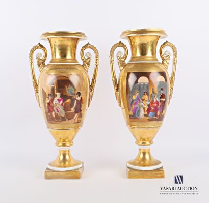 null A pair of white gilt porcelain vases of baluster shape, the body with polychrome...