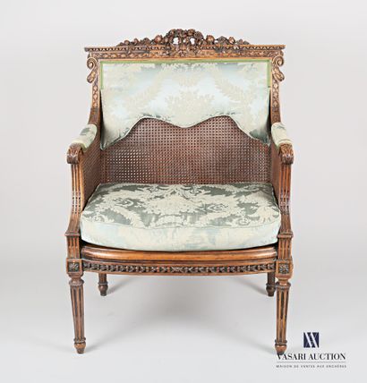null Marquise in natural wood, moulded and carved and caned, the backrest centred...