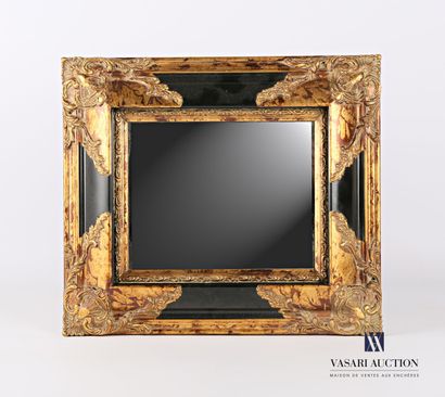 null Resin mirror, painted in the imitation of ebony and gilded, the spandrels decorated...