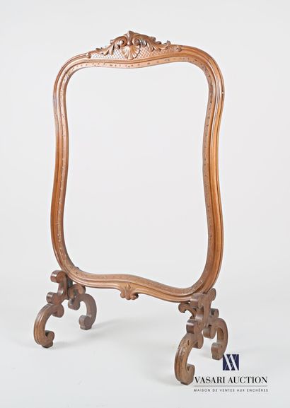 null Mantel screen frame in natural wood, molded and carved, it is topped by a palmette...