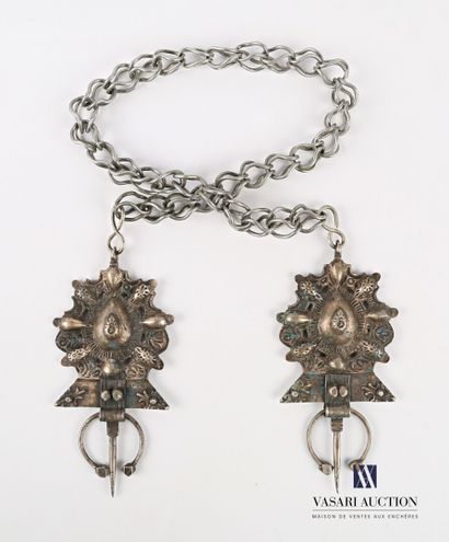 null NORTH AFRICA

Two metal fibulas, the plates with embossed and openwork decoration...