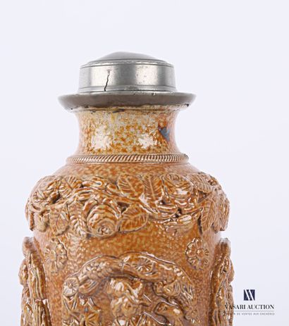null BEAUVAIS

A stoneware tobacco pot in bottle form, the pewter screw lid, the...