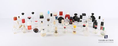 null Lot of about forty-seven glass and plastic perfume bottles of various brands...