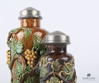 null BEAUVAIS

Two polychrome stoneware tobacco jars in bottle form, the lid with...