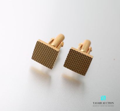 null Pair of gold plated square cufflinks with diamond point motifs.