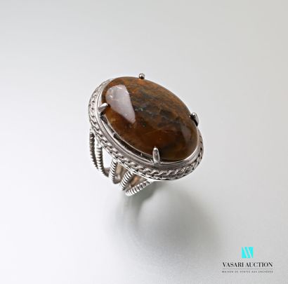 null Metal ring set with a tiger's eye cabochon in its center, the openwork shoulder.

Finger...