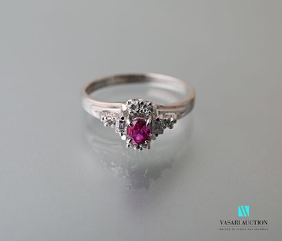 null Ring in platinum 900 thousandth set in its center with an oval-cut ruby of 0.30...