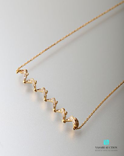 null Necklace in yellow gold 750 thousandths supporting a deploying pendant decorated...