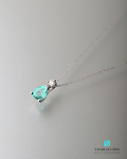null Chain and its pendant in white gold 750 thousandths set with an emerald of pear...