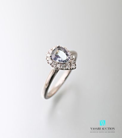 null Ring in white gold rhodium 750 thousandth set with a tanzanite of pear size...