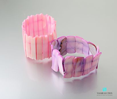 null Set of two bracelets made of pink and mauve tinted mother-of-pearl rods, on...