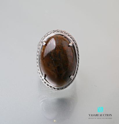 null Metal ring set with a tiger's eye cabochon in its center, the openwork shoulder.

Finger...