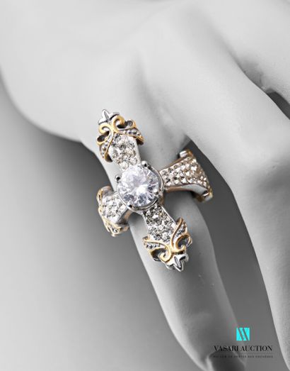 null Steel ring in the shape of a cross decorated with rhinestones, one of which...