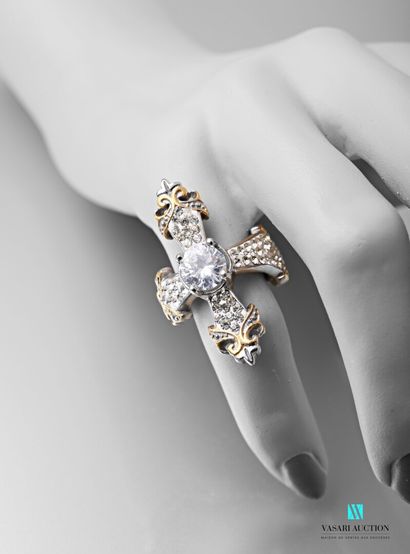 null Steel ring in the shape of a cross decorated with rhinestones, one of which...