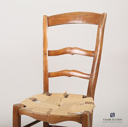 null Set of two chairs in natural wood, the first one has an openwork back with an...