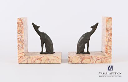 null A pair of bookends featuring two seated deer in regula resting on a right angle...