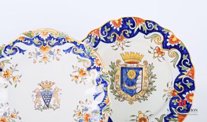null Two polychrome earthenware plates, one decorated with a coat of arms surmounted...