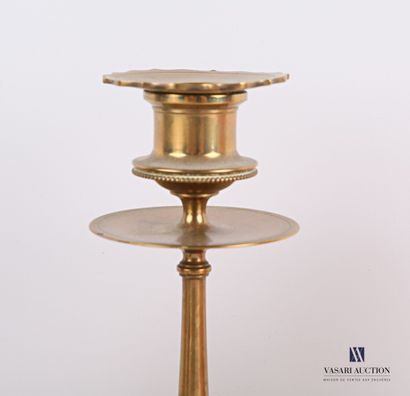 null Lot including a brass candlestick, the ringed shaft presenting a sphere, the...