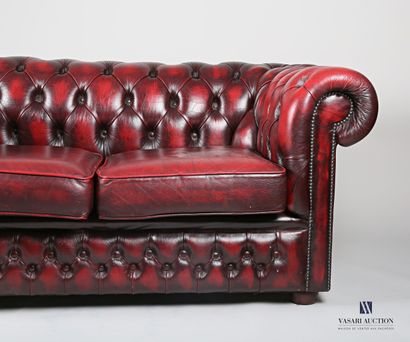 null Chesterfield sofa in imitation leather, cherry color, the back upholstered,...