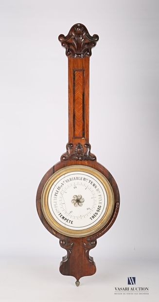 null Barometer in carved natural wood and wood veneer, the round enamel dial is hemmed...