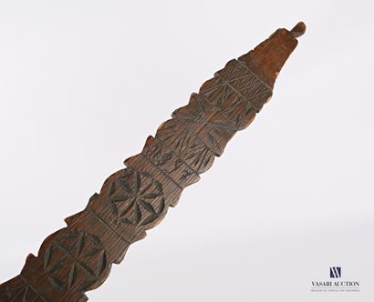 null Wooden lanceolate palette distaff with rosettes and geometrical motifs, marked...