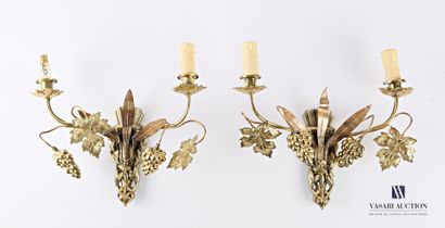  A pair of bronze and brass sconces with two arms decorated with vine branches, the...