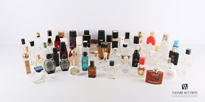 null Lot of about fifty-seven glass and plastic perfume bottles of various brands...