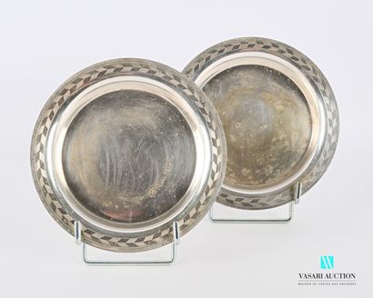 null Pair of silver plated coasters, the border hemmed with a frieze of staggered...