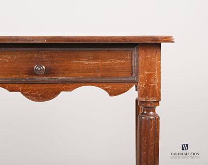 null Writing table in molded natural wood, the top is rectangular, it opens in the...